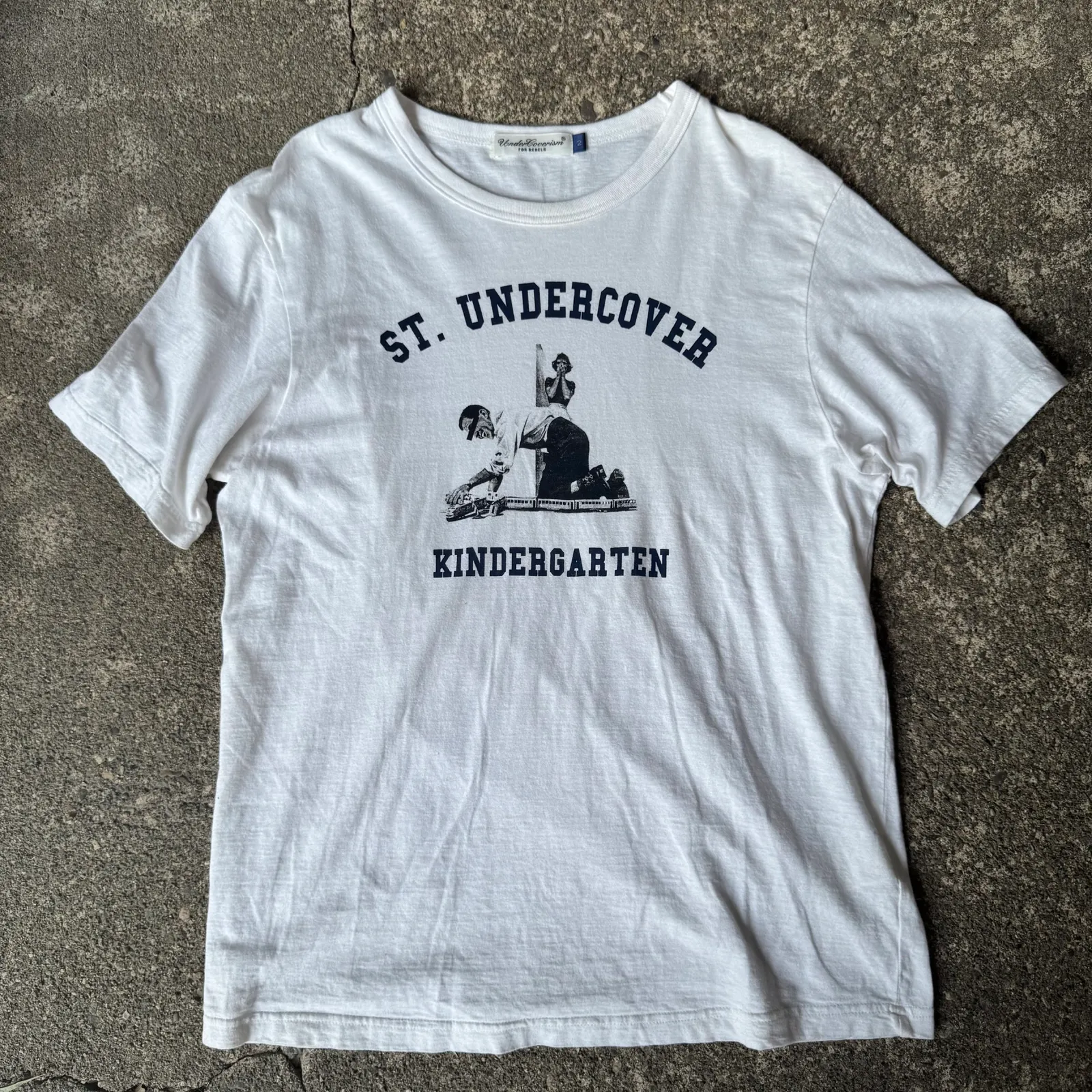 UNDERCOVERISM Undercoverism "St. Undercover Kindergarten" Graphic T-Shirt